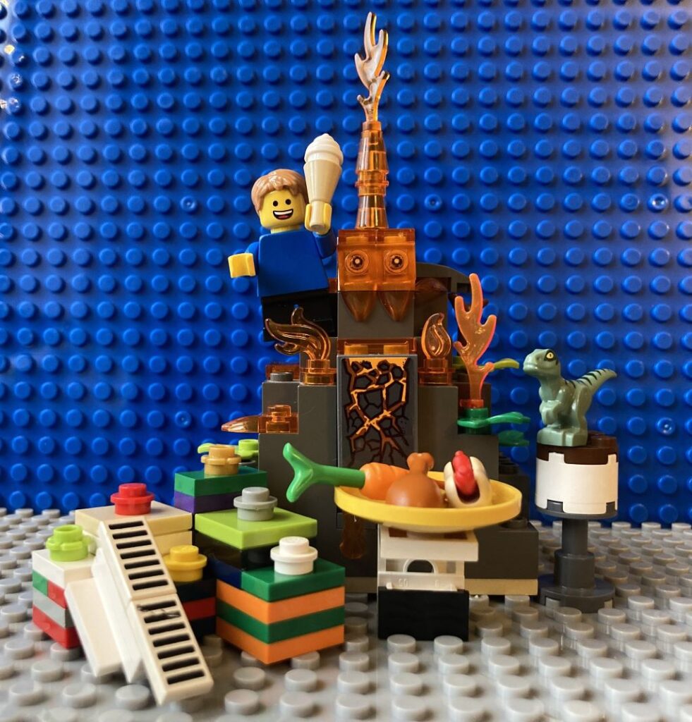 Child celebrating his winter birthday with presents, food and a volcano.