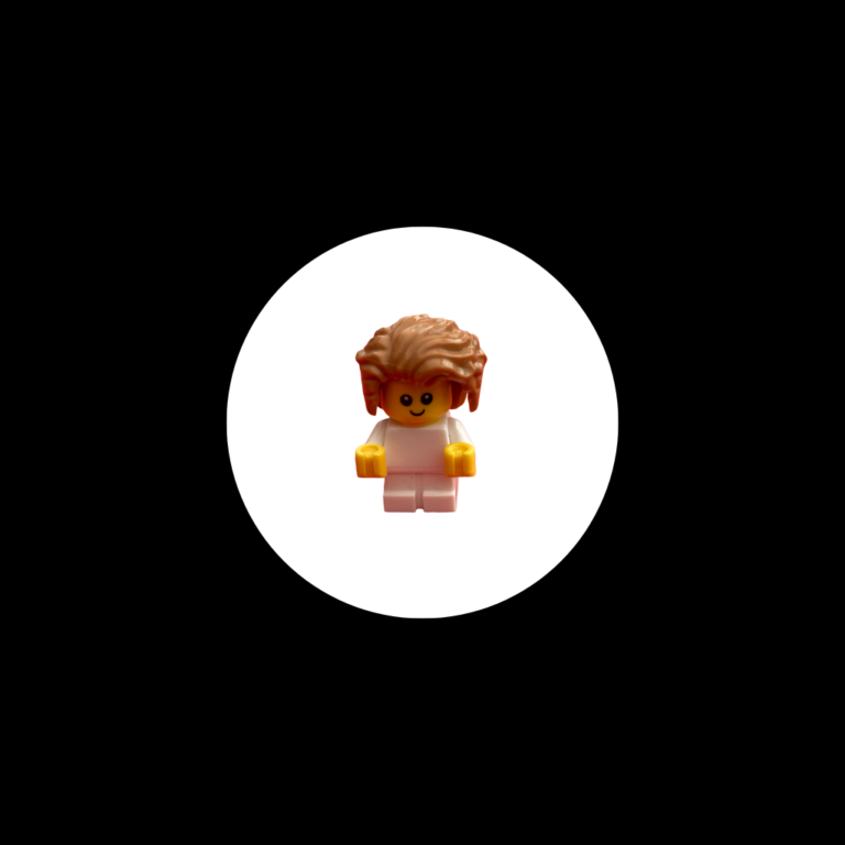 baby with lots of hair in a white hole surrounded by black