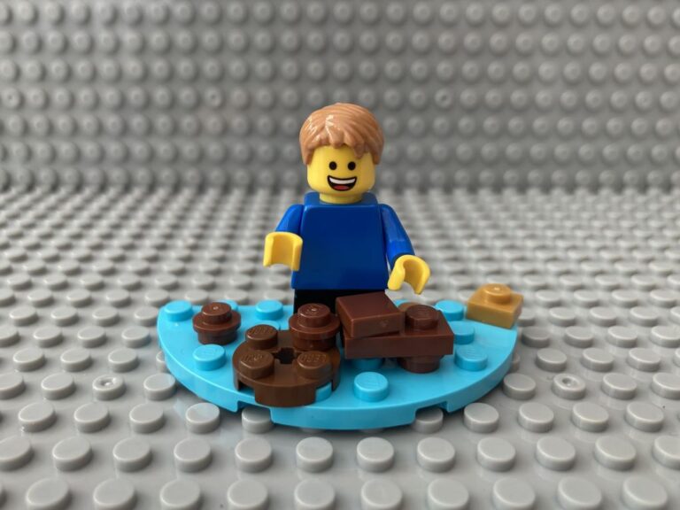 child jumping into a muddy puddle