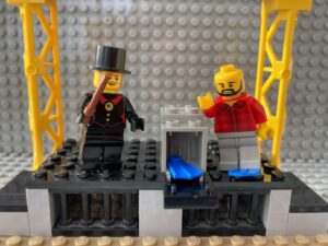 Magician revealing a show in a box trick