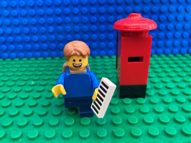 Child posting a letter through a letter box