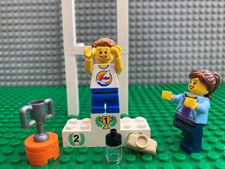 Child standing on a number 1 spot on a podium very excited