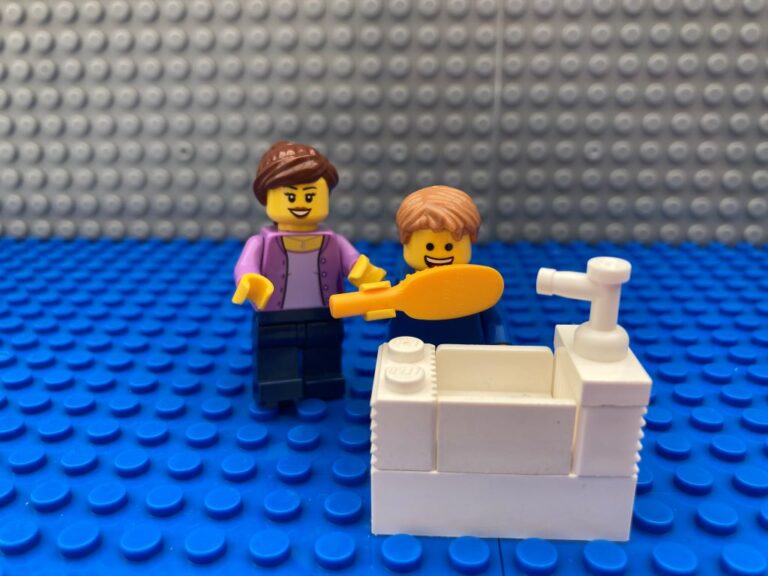 Child brushing their teeth at a sink