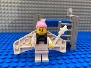 Toothfairy standing next to a child's bed