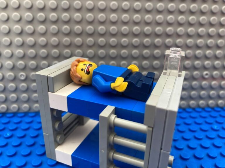 Child in bed with a sore wobbly tooth