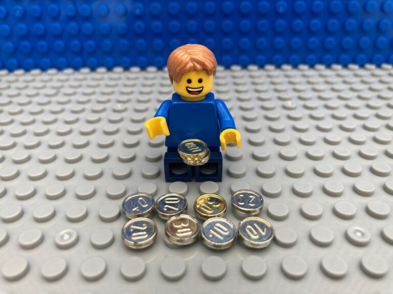 childing counting out coins, his pocket money from his piggy bank