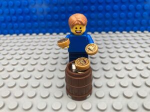 Child holding his pocket money, allowance, piggy bank.