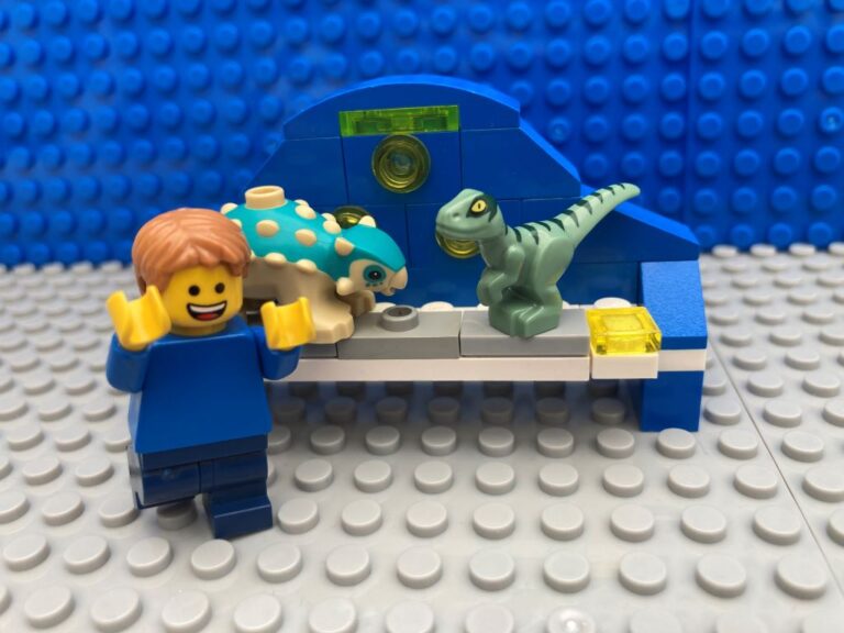 toy shelf full of dinosaurs