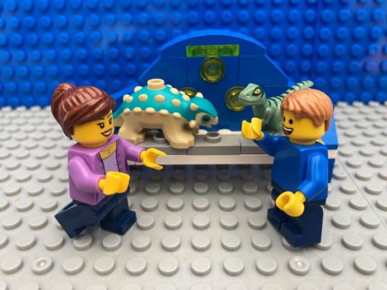 Shelf full of dinosaur toys