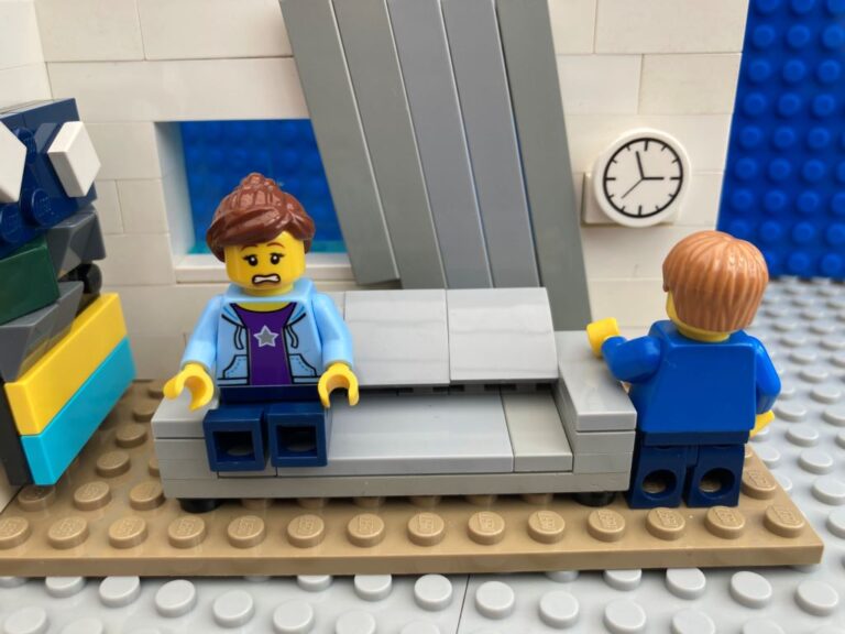 Child watching the clock as he waits for his brother to get home