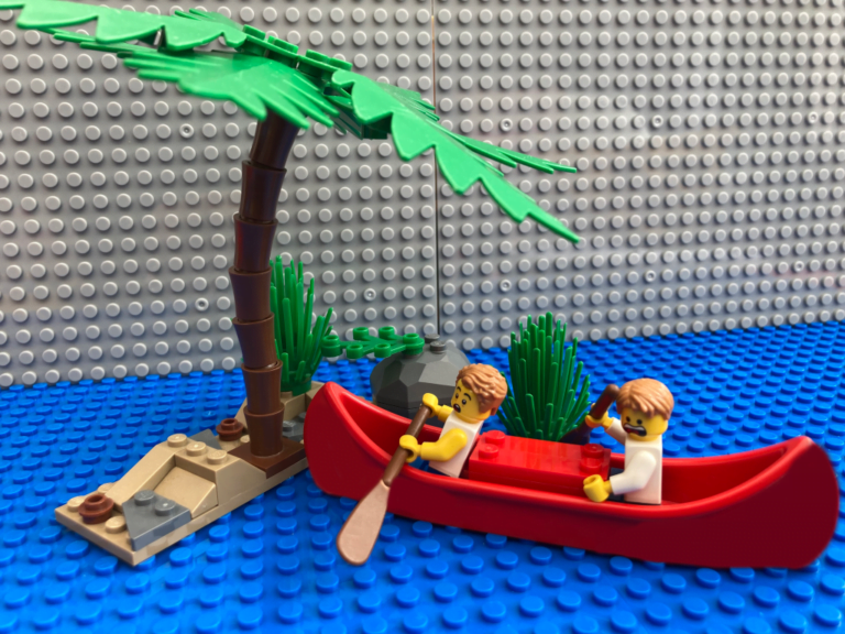 two children in a canoe crashing into a rock