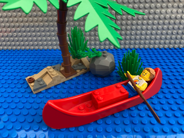 child resting in a canoe