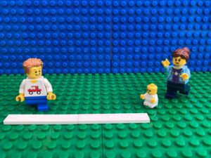 Mum chasing toddler around the sports day races