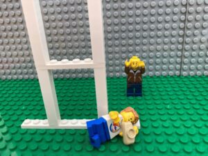 excited child scoring a rugby try with dad celebrating