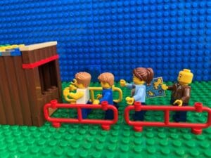 family at the front of the queue at a ride