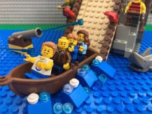 family getting splashed at the bottom of the log flume