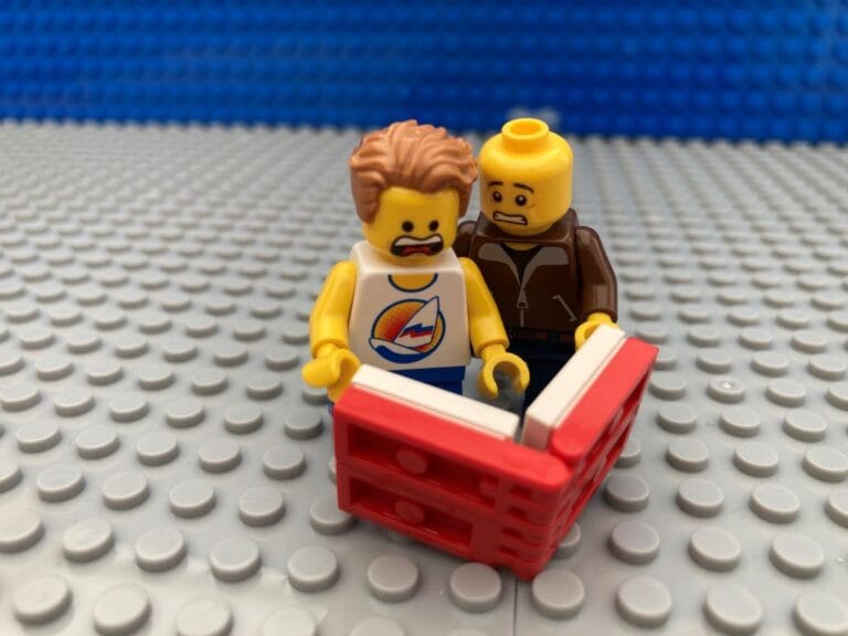 Dad and child looking at a maths book horrified