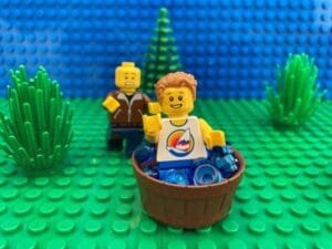 child tripping over a bucket of water