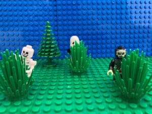 monsters peering around the bushes in a dark garden