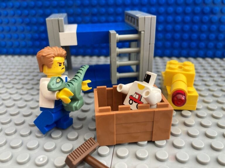 Child putting toys in a box - doing chores at home