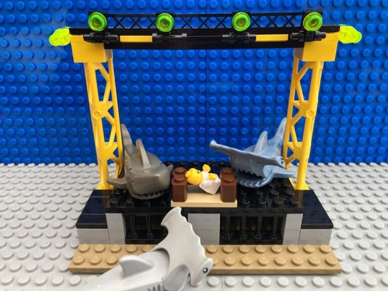 sharks surrounding the baby Jesus in a manger