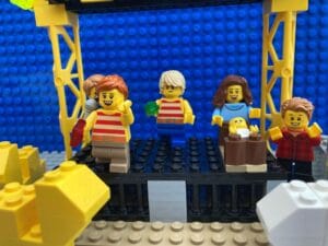 Christmas nativity play with one child hiding at the back behind all the other children