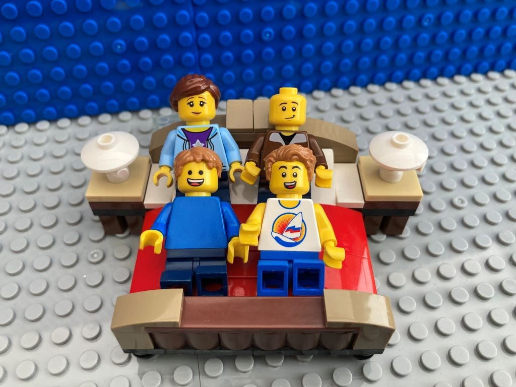 Family laughing together once the playful prank is over