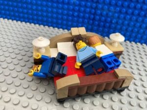 Family asleep on the bed