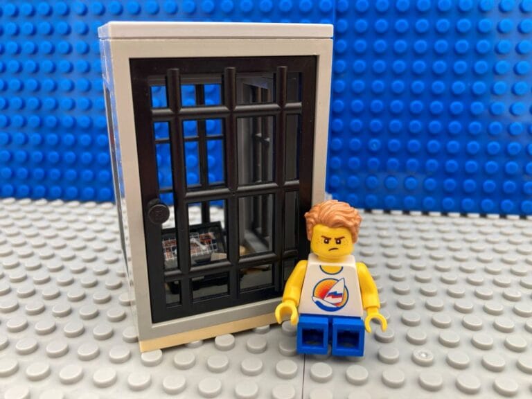 Grumpy child sat next to screen time jail