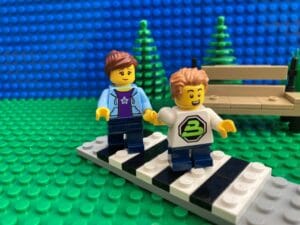 Parent and child crossing the road