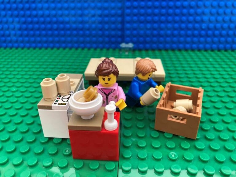 Family making bird feeders in the kitchen