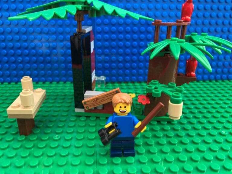 Child pointing to a homemade kid friendly bird feeder