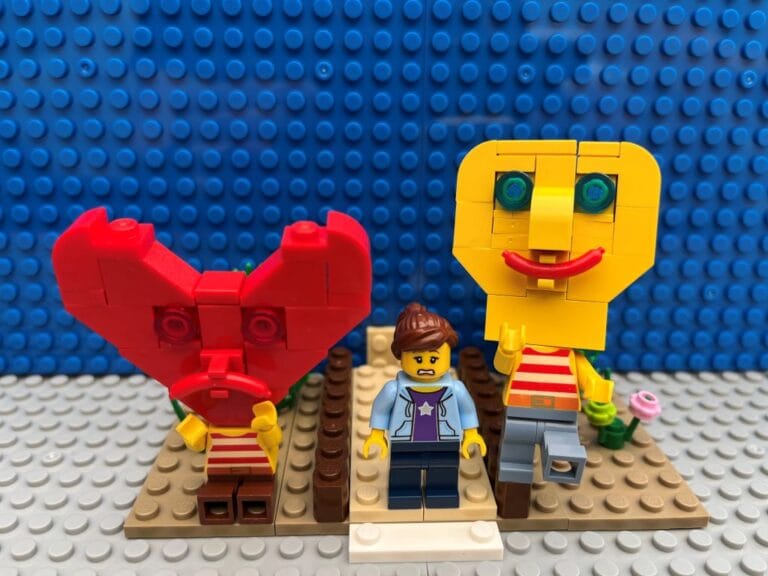 Heart character sitting with head in hands. Head character dancing happily as Mum makes a decision about child crossing the road