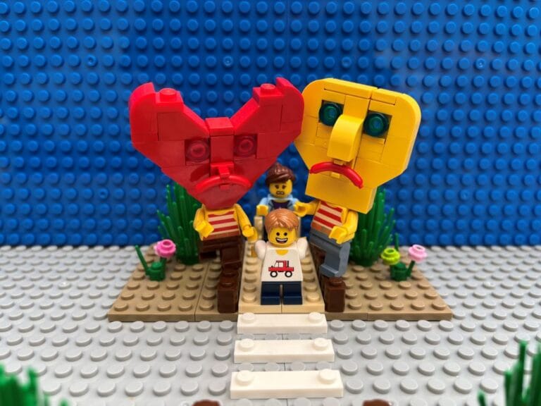 Both Head and Heart characters holding back young child from crossing the road
