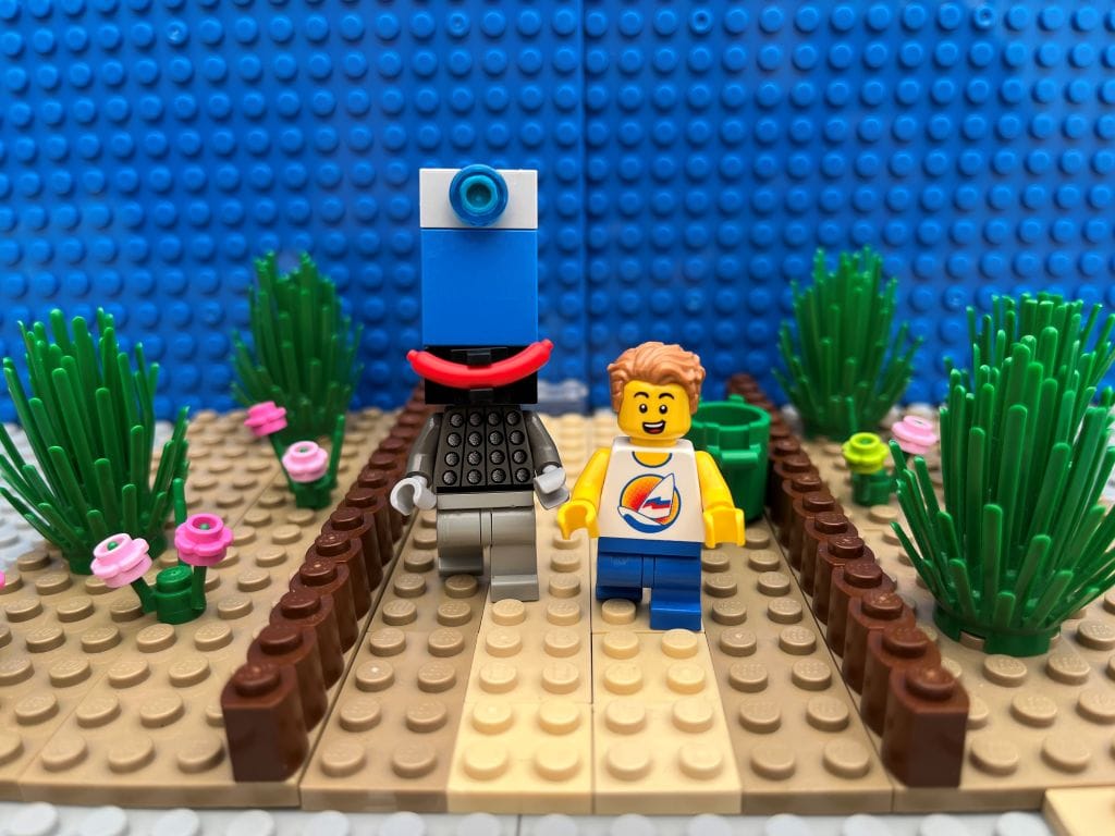 Child walking alongside a smartphone character down a street on their way to high school