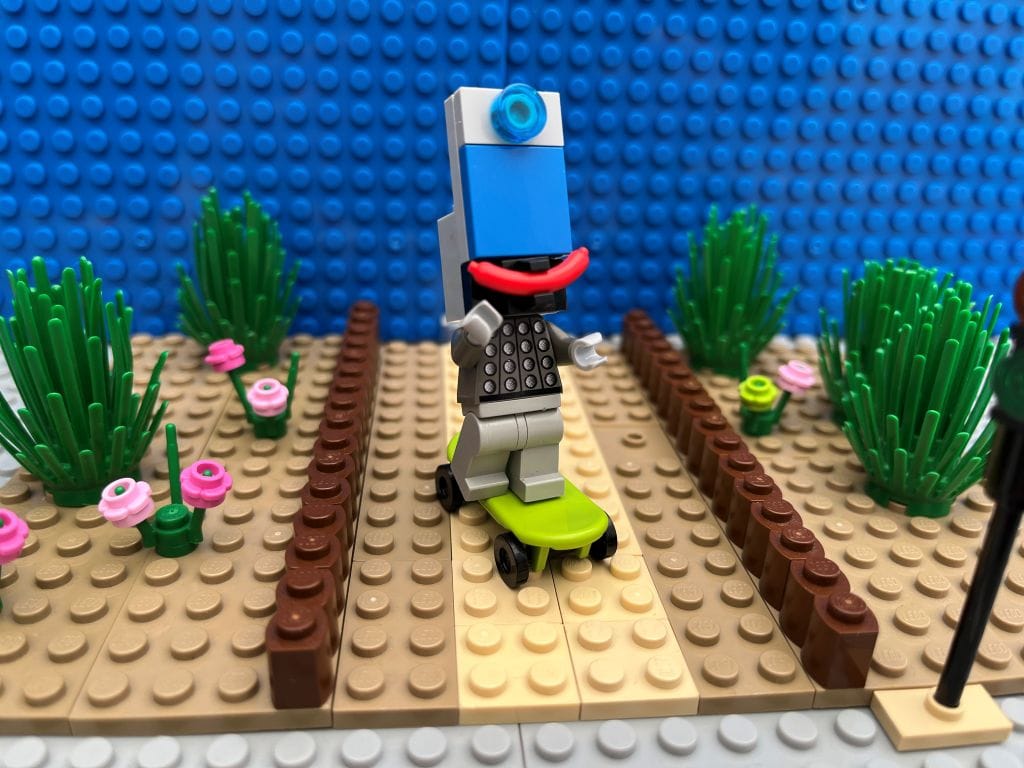 Smartphone character happy on a skateboard
