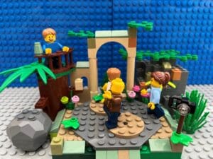 Mum taking photos of family exploring the ruins of an old castle