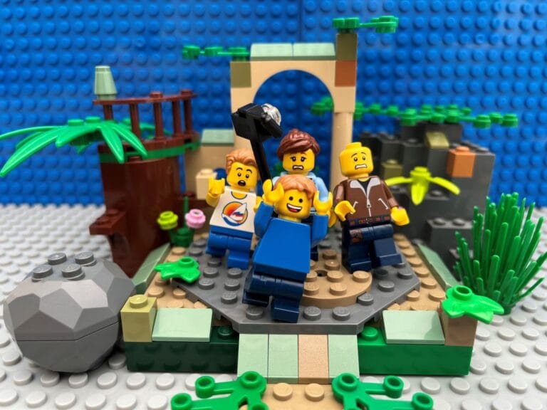 Family taking a bad family photo with a selfie stick in the ruins of an old castle.