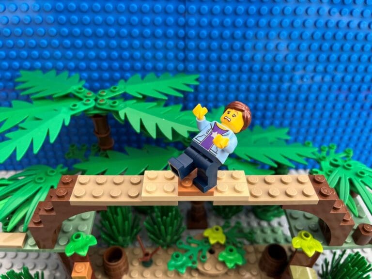 Mum on a balancing obstacle course in the trees looking scared