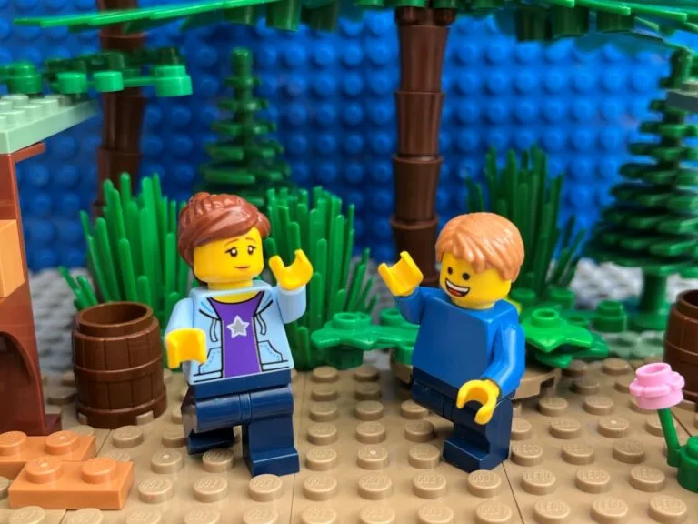 Mum and child happy to be back at the bottom of the zipline