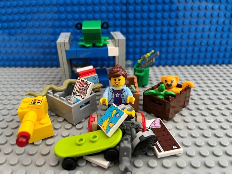 Mum having a January clear out with a pile of unwanted toys and empty boxes to put them in