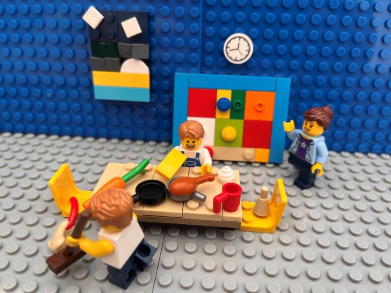 Family clearing the dining table after lunch