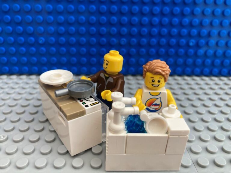 Dad and son washing up together