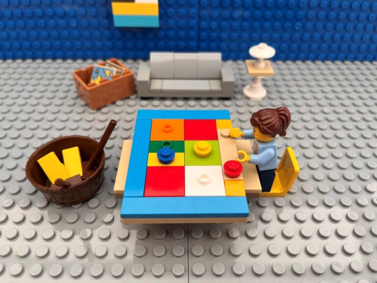 Mum working on a new chores chart at a table