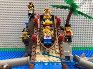 Family at the top of a big water slide about to come down the big drop at Legoland Windsor, a great birthday day trip idea for 10 year olds