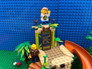 Child standing at the top of the climbing frame shouting that he can't get down