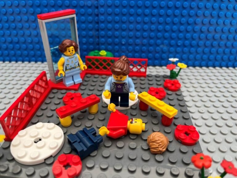 Broken lego figure in pieces in school playground